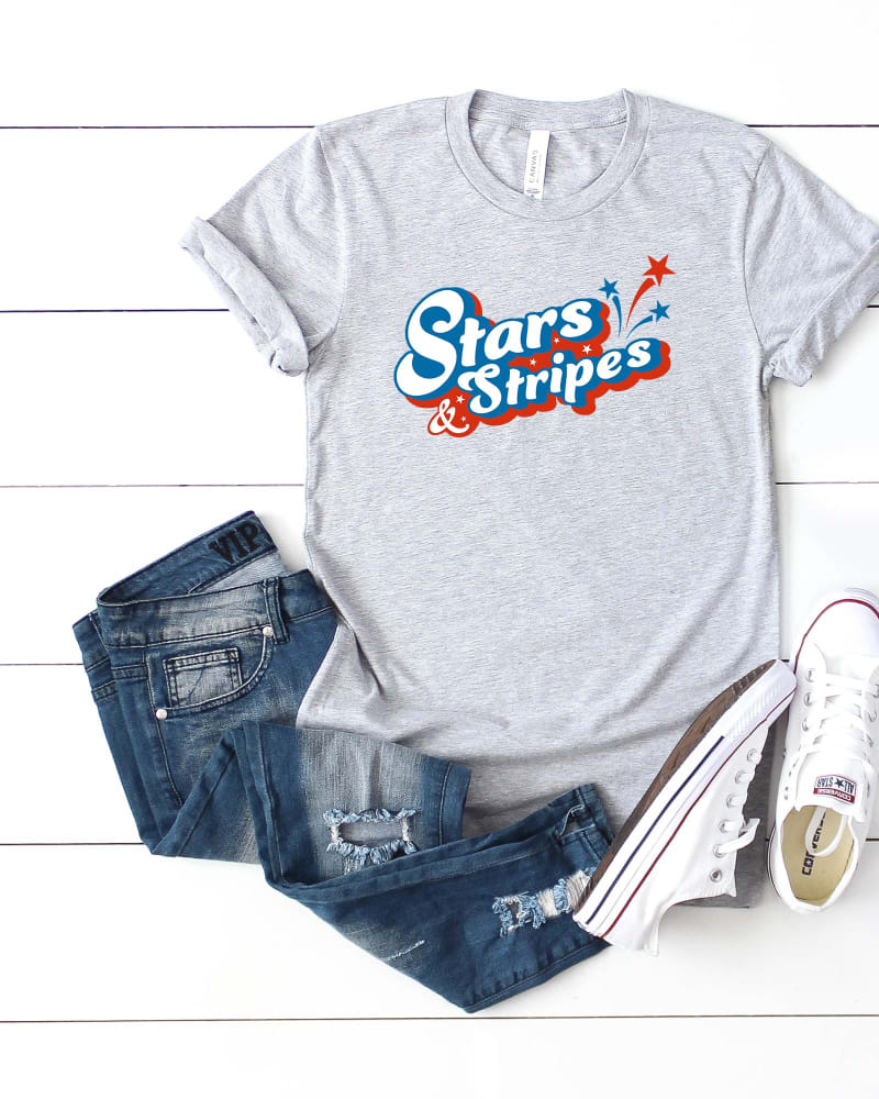 Front of a size Large Stars and Stripes Firework in Heather Grey by Simply Sage Market. | dia_product_style_image_id:281571
